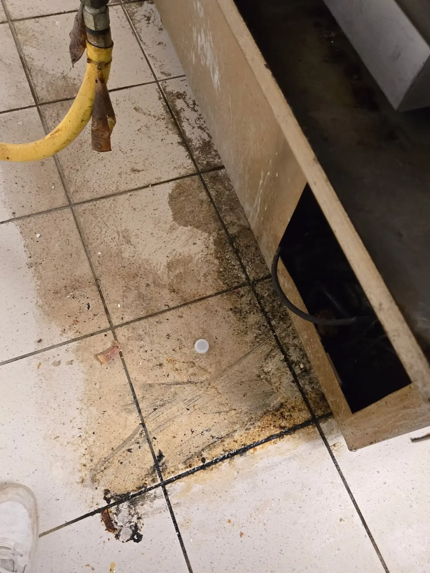 Commercial kitchen floor before degreasing