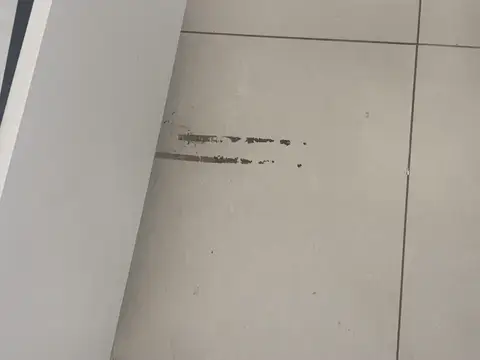Marked nail salon floor before deep cleaning